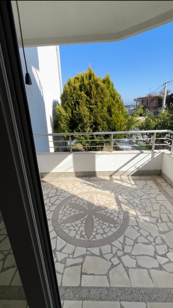 Stunning glass door view to a tiled balcony in Ulcinj, Montenegro&mdash;prime property by Ekosphere doo on immorenta.me.