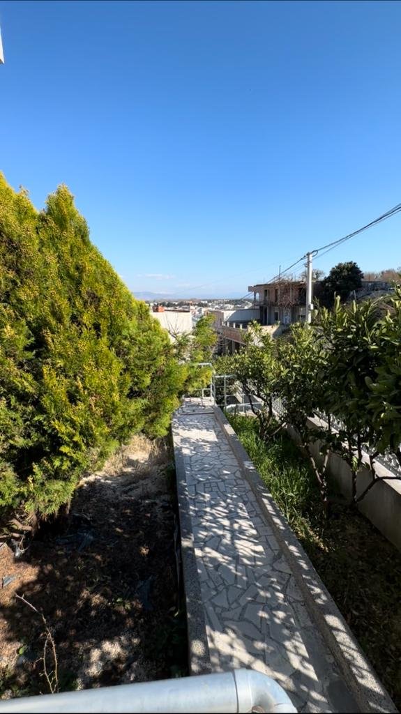 Scenic tiled path curves through lush greenery toward prime Ulcinj properties&mdash;exclusive on immorenta.me by ekosphere doo.