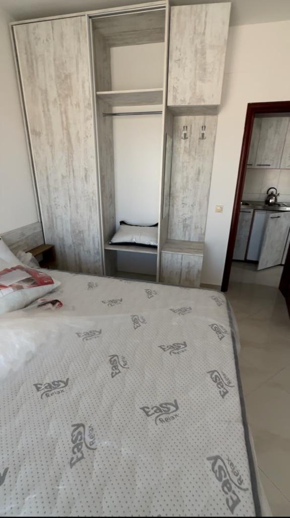 Modern Ulcinj bedroom with cozy bed, wardrobe, kitchen access&mdash;prime Montenegro real estate by ekosphere doo at immorenta.me.