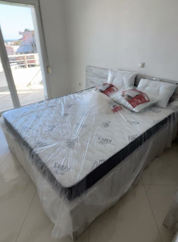 Modern double bedroom with stunning Ulcinj views, stylish tile floors, and chic decor&mdash;exclusive at Montenegro-Listings.me by Ekosphere doo.