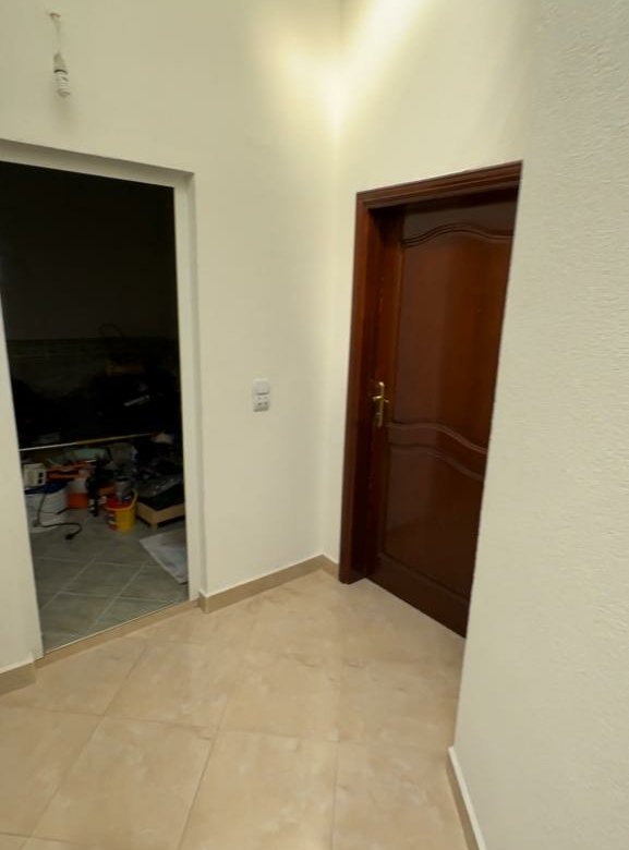 Spacious hallway with beige tiles and white walls in Ulcinj, Montenegro&mdash;exclusive property by immorenta.me (EkoSphere DOO).