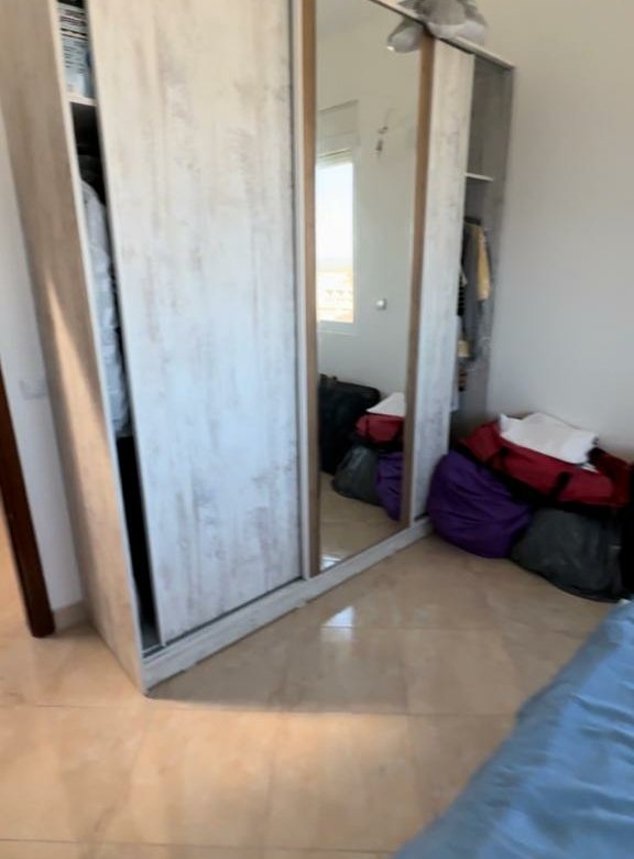 Modern bedroom in Ulcinj, Montenegro with mirrored wardrobe, spacious layout, and investment appeal. Listed on immorenta.me by ekosphere doo.