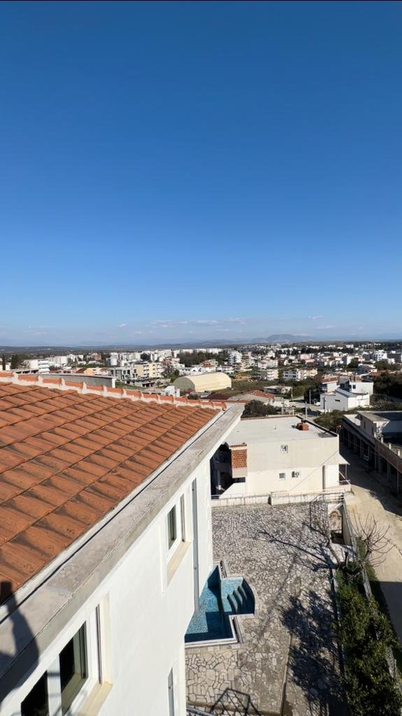 Stunning Ulcinj rooftop view: red-tiled roofs, white homes, pool & cityscape&mdash;prime real estate by ekosphere doo on immorenta.me.