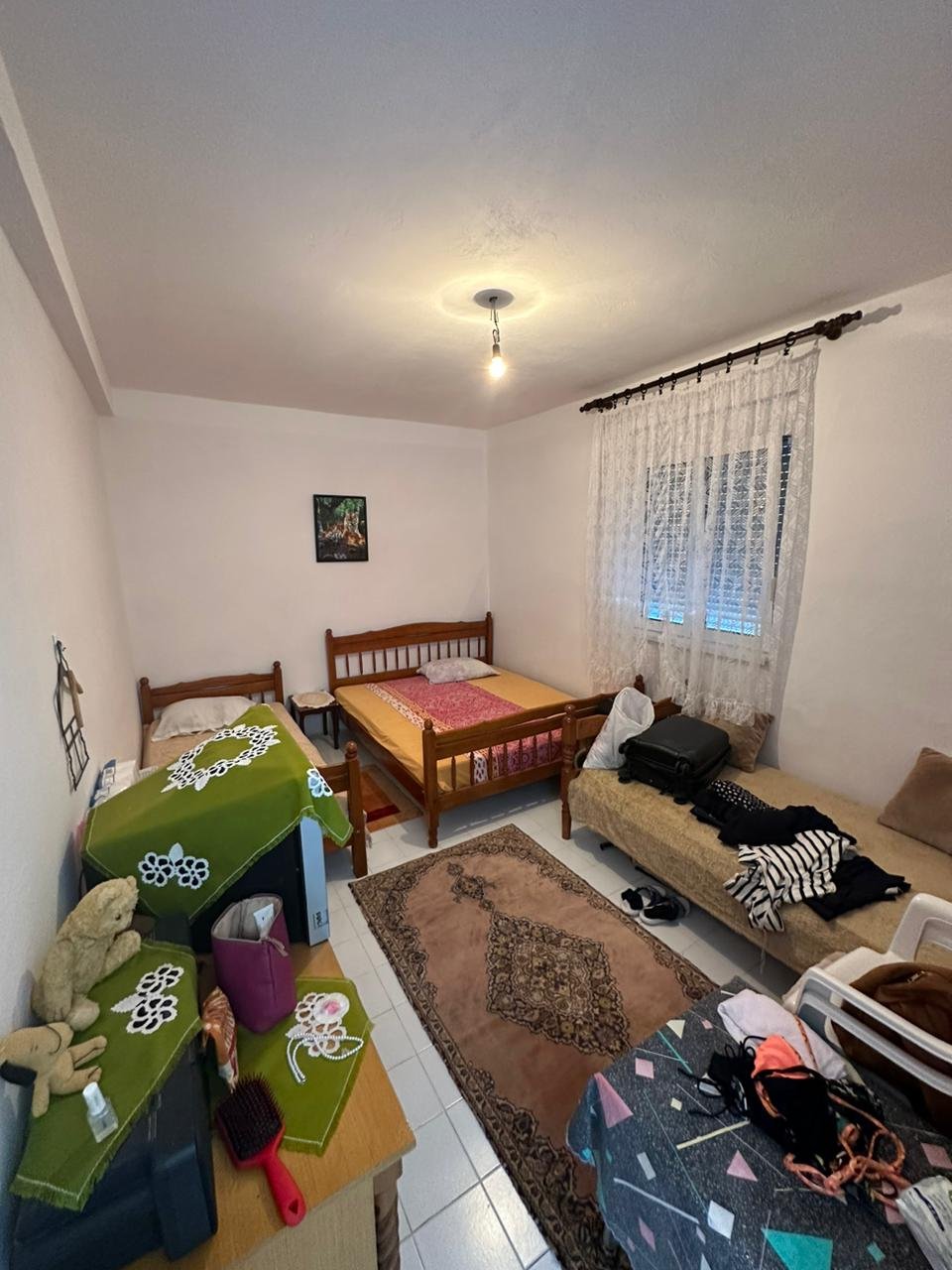 Charming Ulcinj bedroom with 2 single beds, window, rug & storage. Ideal Montenegro real estate. Eksophere doo&mdash;immorenta.me.