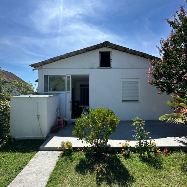 Charming white house in Ulcinj, Montenegro with patio, garden, and lawn&mdash;ideal for investment. Listed by ekosphere doo on immorenta.me.