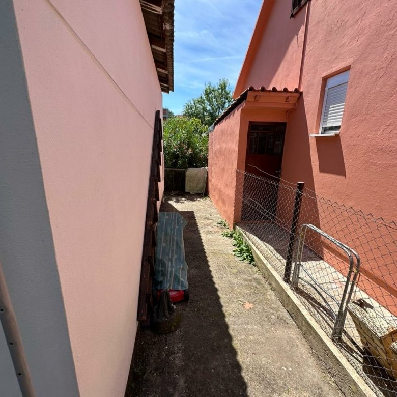 Charming Ulcinj investment: concrete pathway between pink properties, fenced garden. Exclusive on immorenta.me by ekosphere doo.