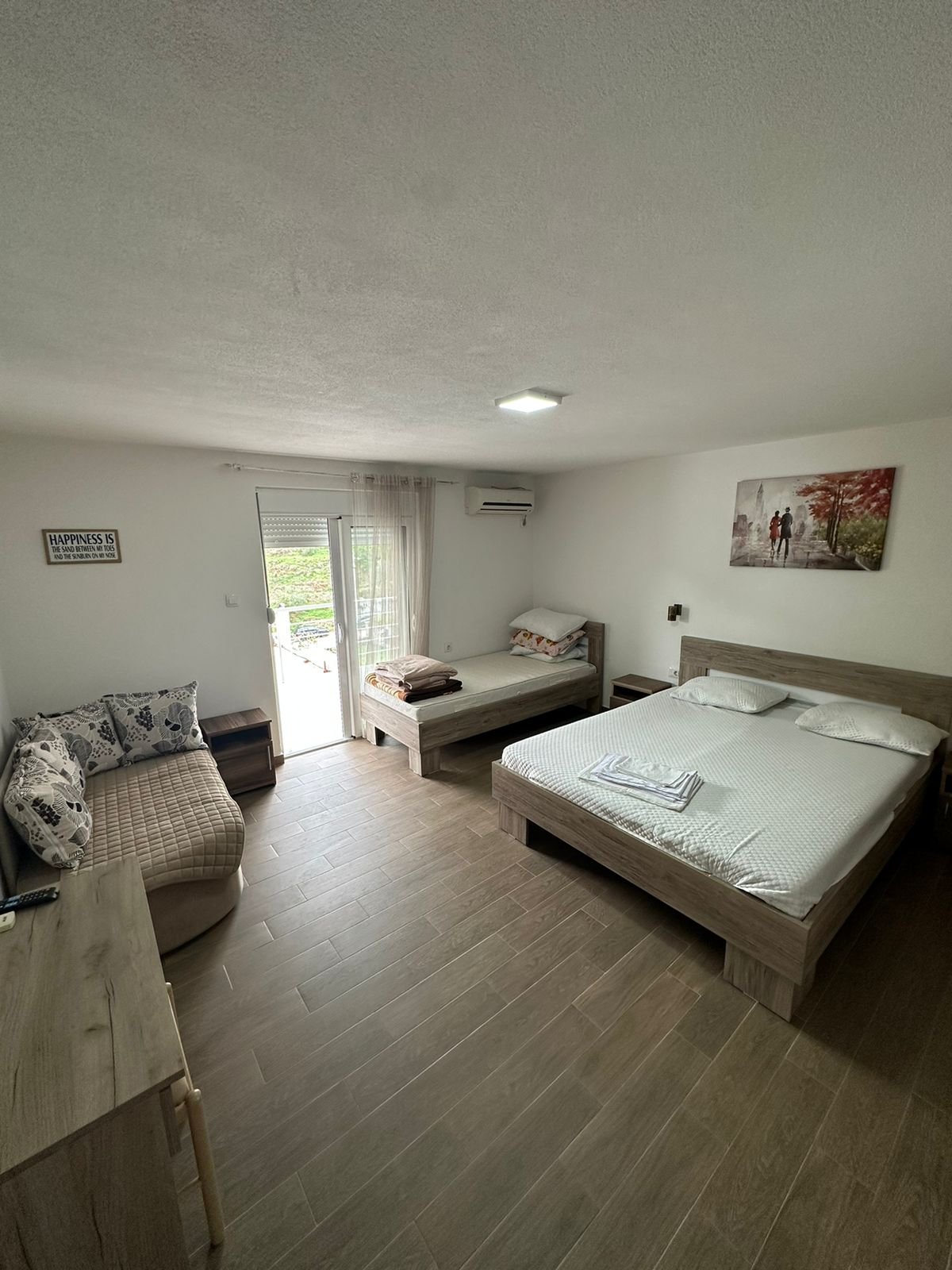 Bright, furnished Ulcinj bedroom with beds, sofa, desk & scenic views&mdash;prime investment via immorenta.me by Ekosphere Doo.