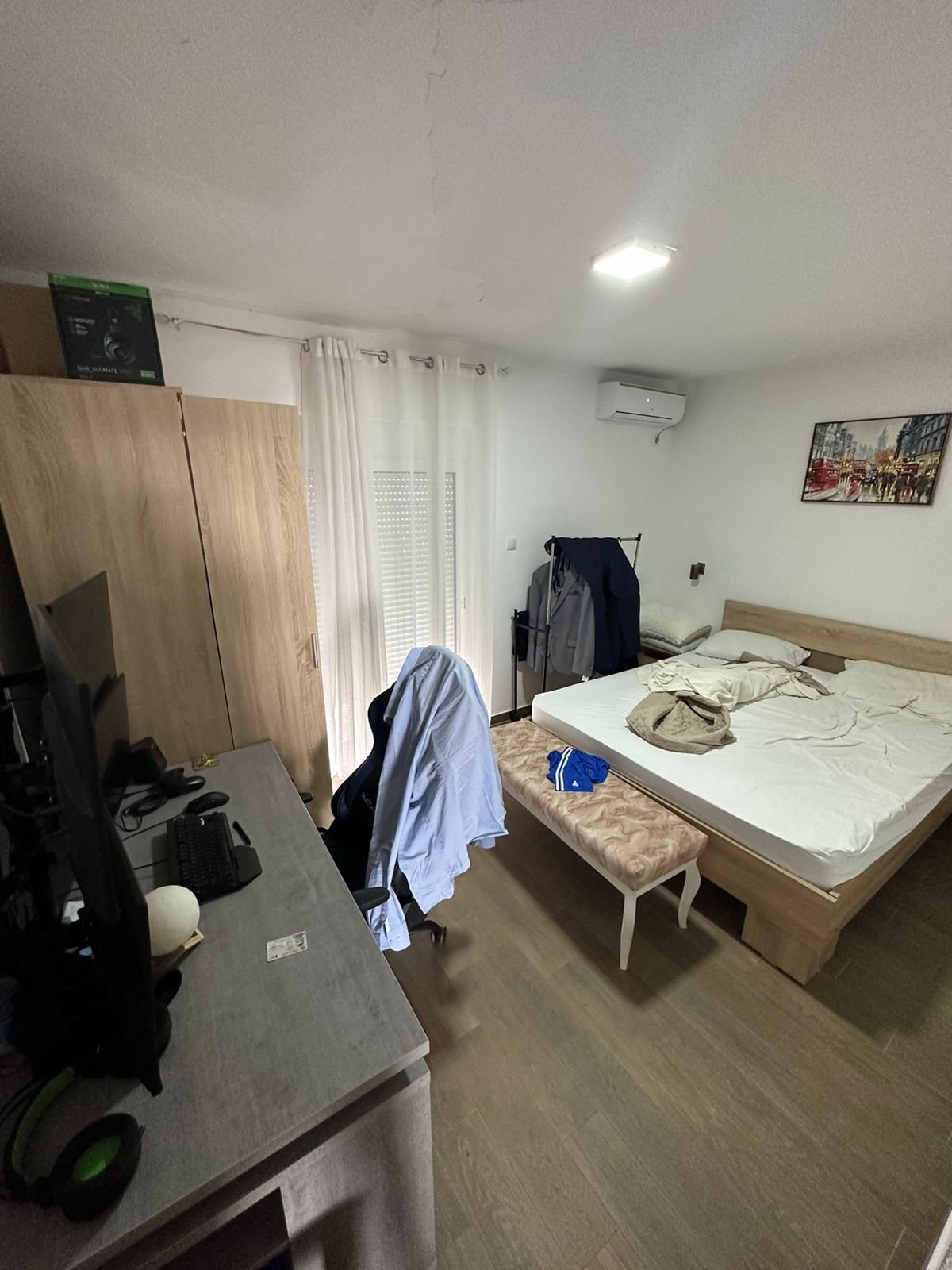Bright Ulcinj bedroom with spacious bed, desk, wardrobe & sunlit curtains&mdash;prime property at immorenta.me by Ekosphere doo.