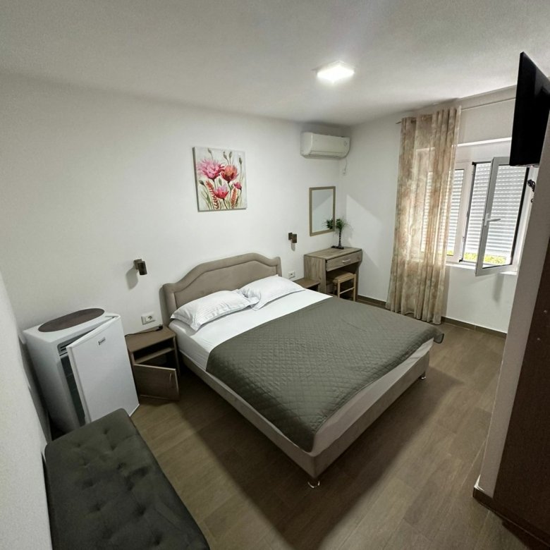 Modern hotel room in Ulcinj: double bed, desk, AC, TV&mdash;perfect Montenegro property investment via immorenta.me by ekosphere doo.