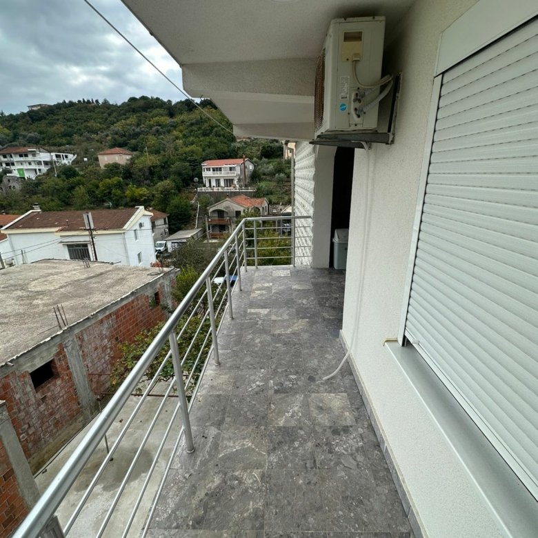 Stylish tiled balcony with metal railing, AC, and scenic Ulcinj views&mdash;ideal Montenegro investment via immorenta.me by ekosphere doo.