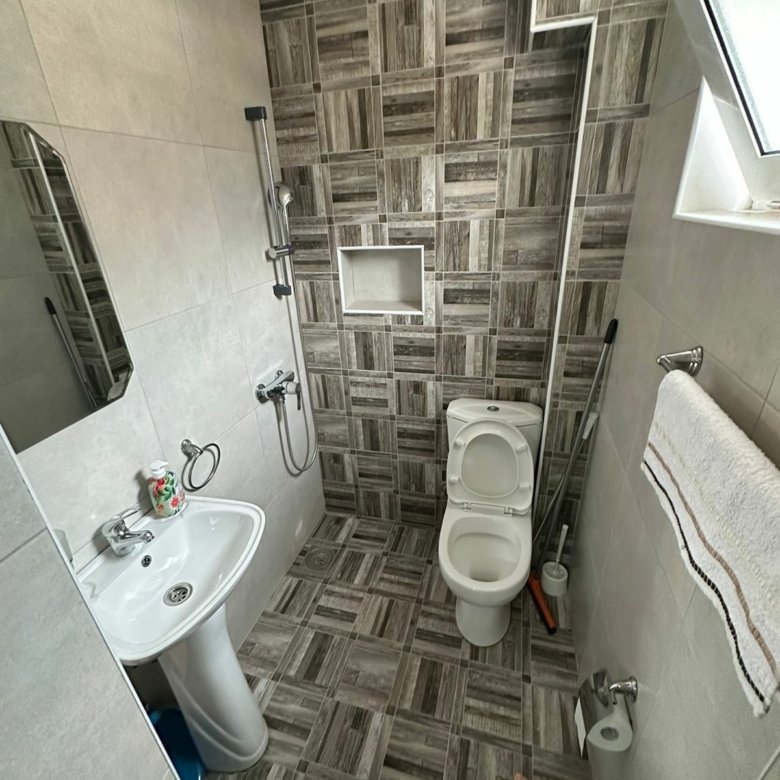 Modern bathroom in Ulcinj property with elegant tiles, shower, and amenities&mdash;exclusive listing on immorenta.me by ekosphere doo.