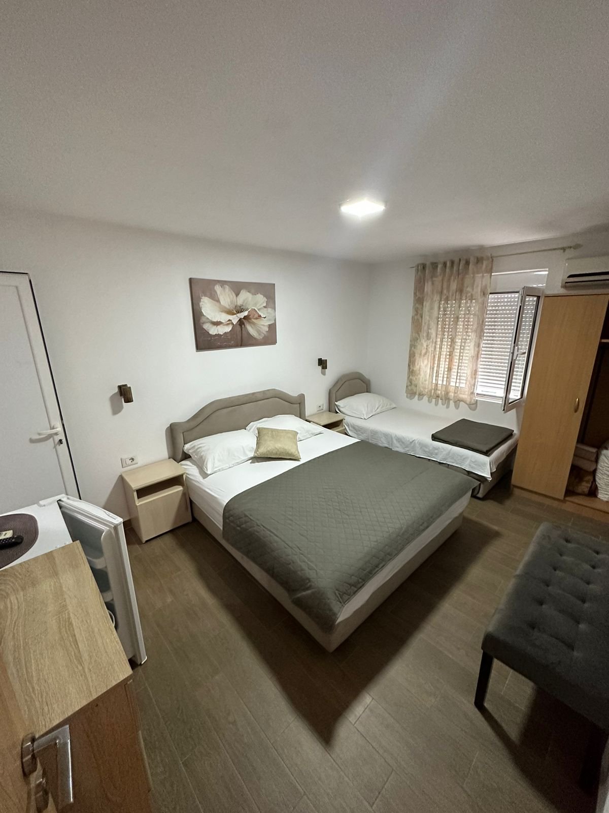 Modern hotel room in Ulcinj, Montenegro with double and single beds&mdash;ideal investment via immorenta.me by Ekosphere doo.