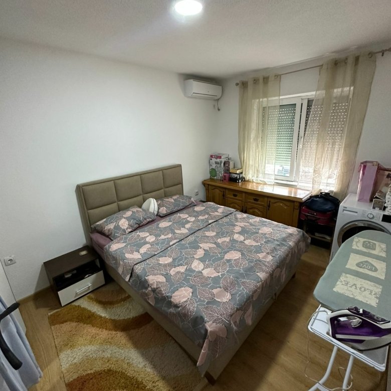 Elegant Ulcinj bedroom with double bed, stylish decor, and natural light&mdash;prime property from immorenta.me by Ekosphere DOO.