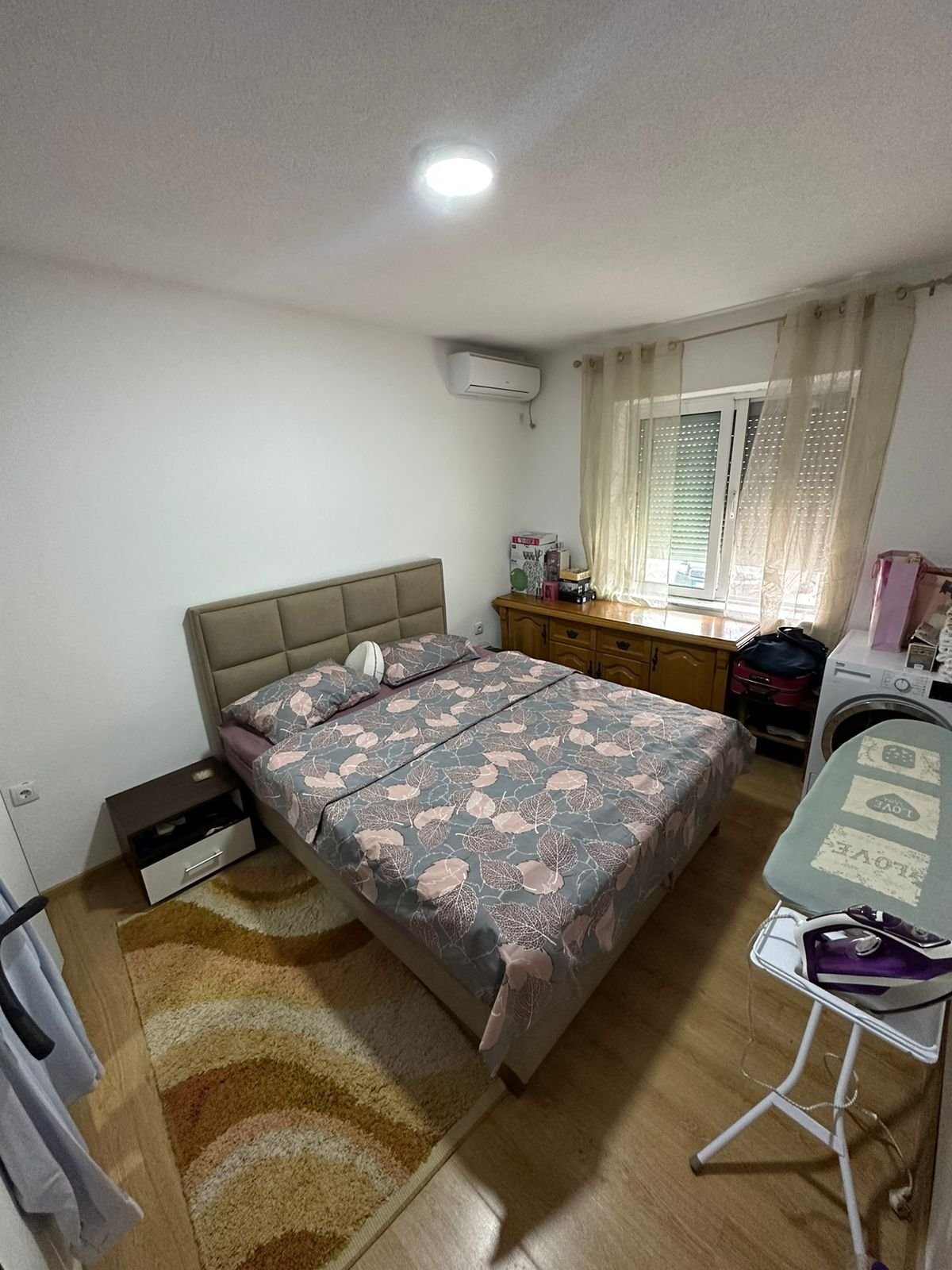 Elegant Ulcinj bedroom with double bed, stylish decor, and natural light&mdash;prime property from immorenta.me by Ekosphere DOO.