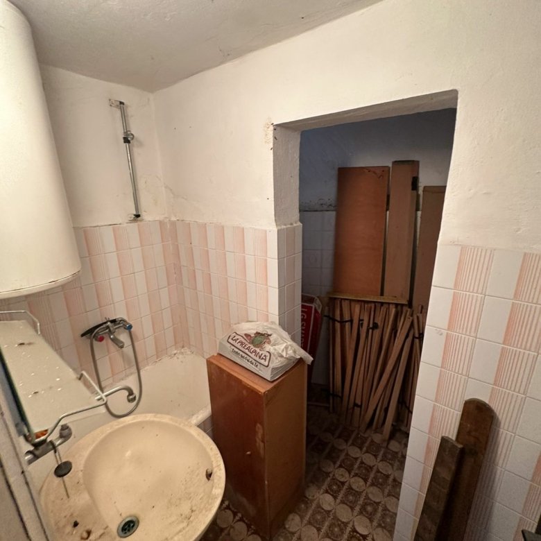 Charming fixer-upper bathroom in Ulcinj, Montenegro&mdash;tiled, with cabinet and storage. Investment potential on immorenta.me by ekosphere doo.
