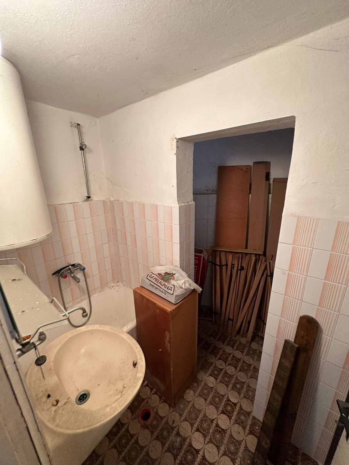 Charming fixer-upper bathroom in Ulcinj, Montenegro&mdash;tiled, with cabinet and storage. Investment potential on immorenta.me by ekosphere doo.