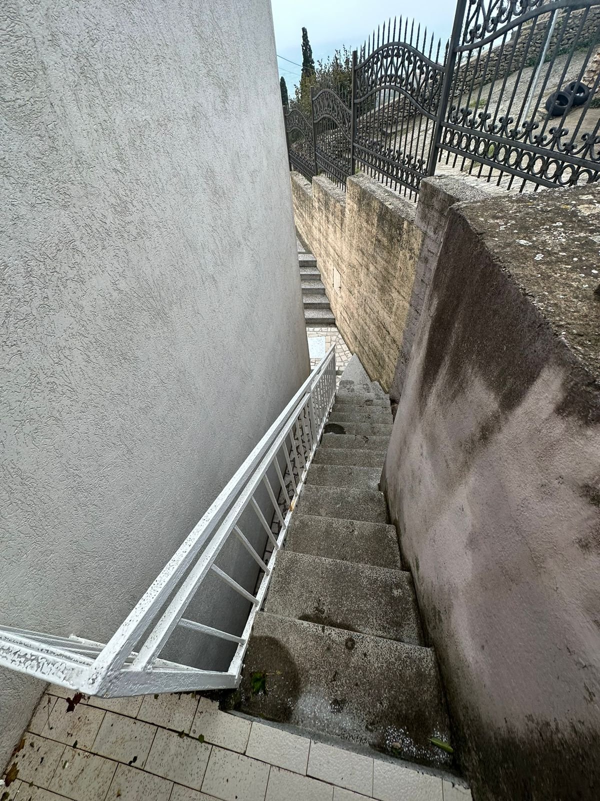 Experience Ulcinj Montenegro&rsquo;s charm: stylish concrete steps, stone walls, secure fencing&mdash;ideal for investment. By ekosphere doo.