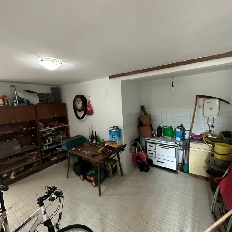 Versatile Ulcinj property with storage shelves, workbench, stove, and sink&mdash;ulcinj real estate via immorenta.me/Ekosphere doo.