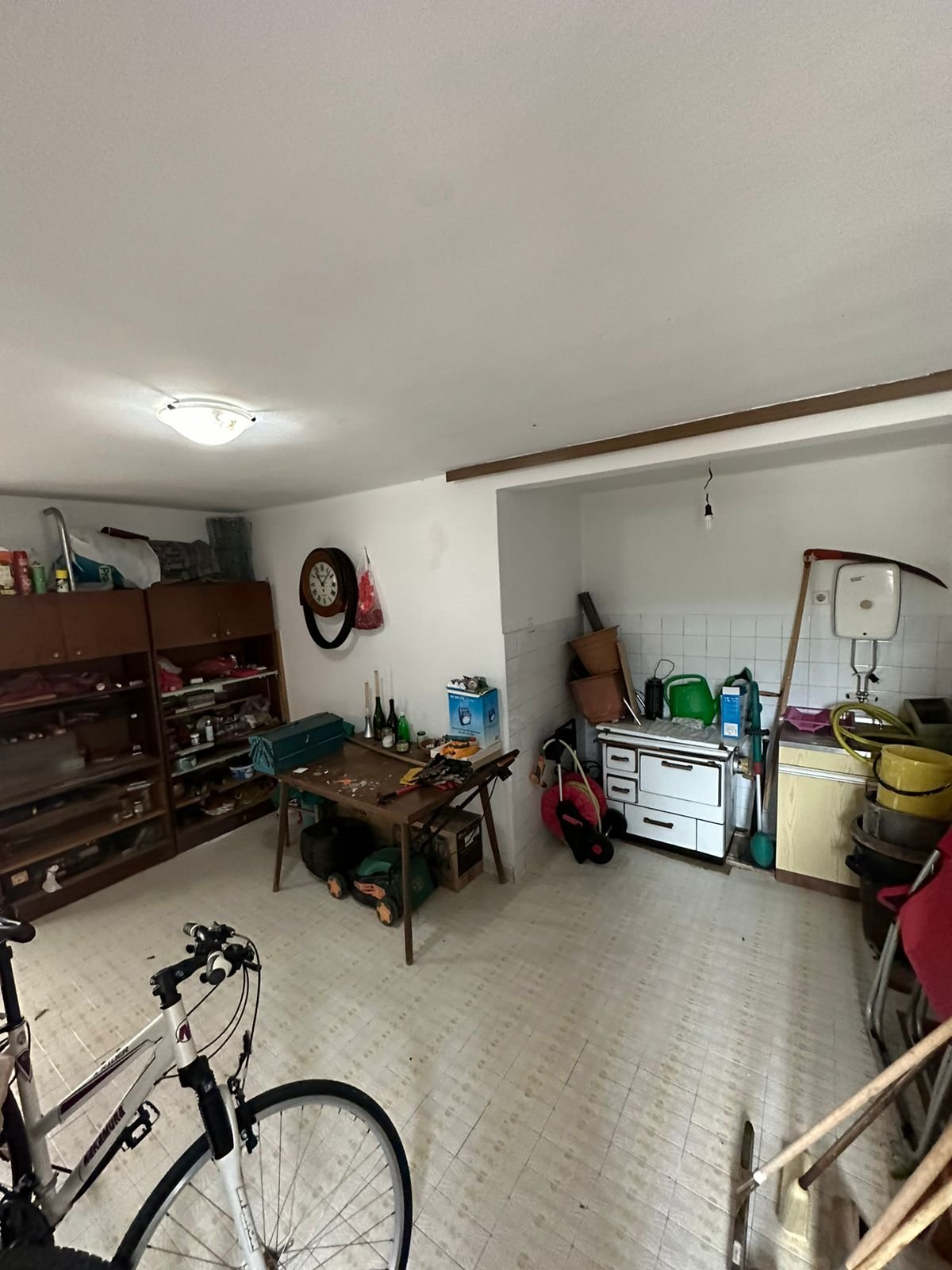 Versatile Ulcinj property with storage shelves, workbench, stove, and sink&mdash;ulcinj real estate via immorenta.me/Ekosphere doo.