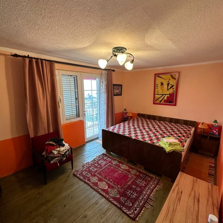 Spacious Ulcinj bedroom with double bed, balcony, stylish decor&mdash;prime Montenegro real estate via immorenta.me by ekosphere doo.