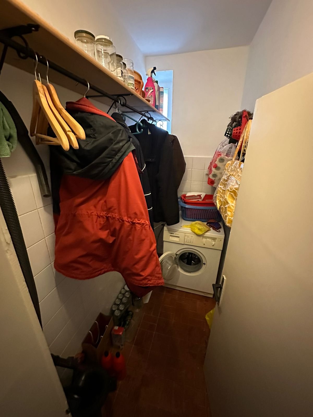 Efficient Ulcinj laundry room with washer, storage, and tiled finishes. Invest in Montenegro real estate via immorenta.me by ekosphere doo.