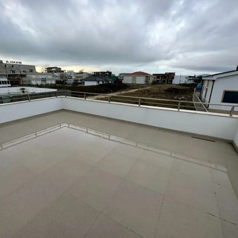 Spacious rooftop terrace with elegant tiles and modern railings, offering panoramic Ulcinj views&mdash;prime real estate at immorenta.me by ekosphere doo.