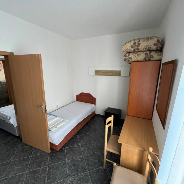 Cozy Ulcinj room for sale: single bed, desk, wardrobe, tiled floor, access to extra space. Great investment via immorenta.me by Ekosphere Doo.