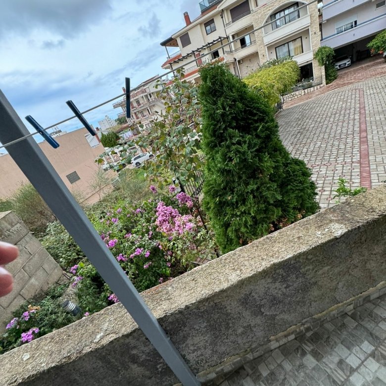 Charming Ulcinj property with lush garden, pink flowers, paved drive, scenic apartments&mdash;top Montenegro investment via ekosphere doo.