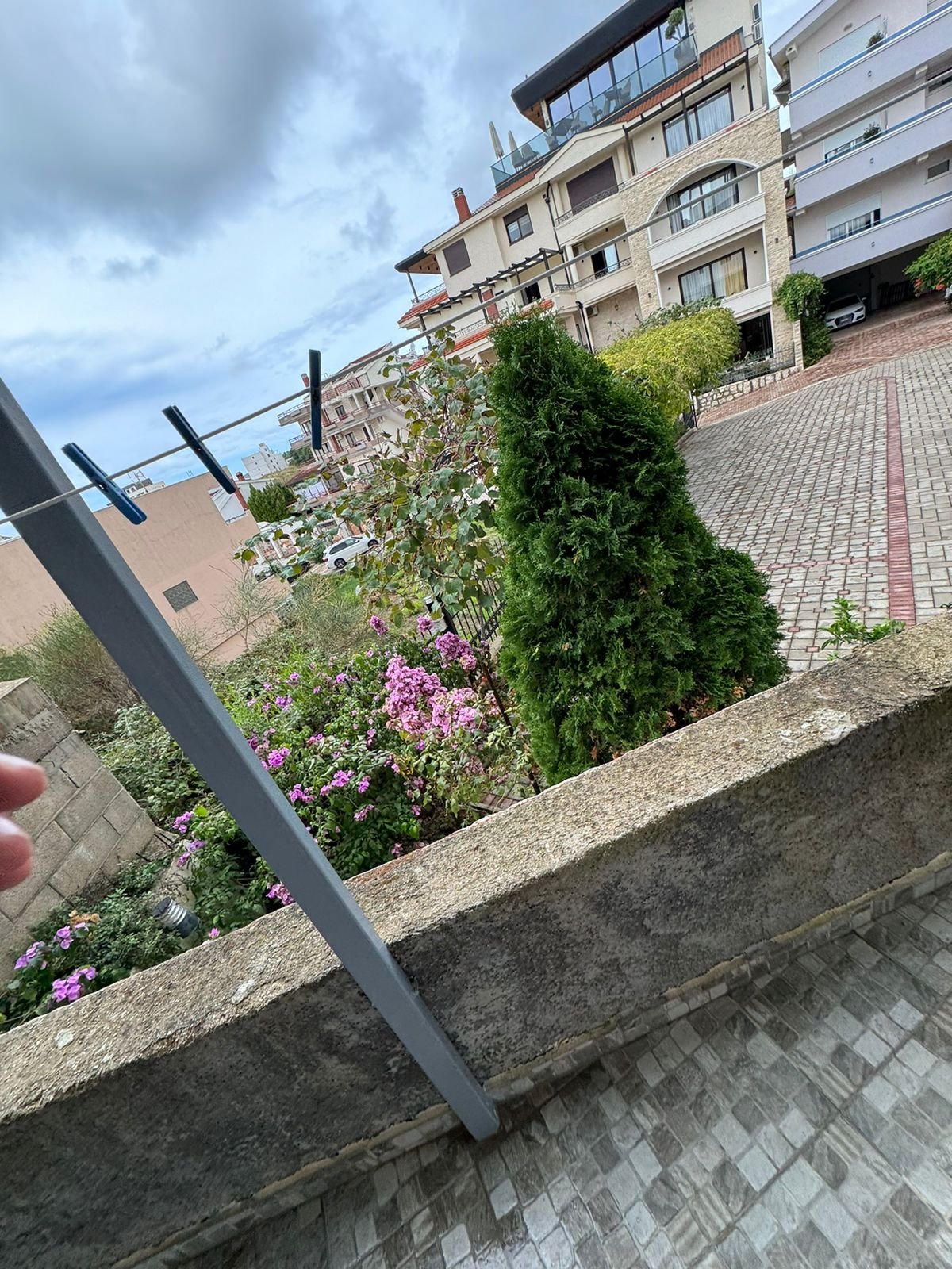 Charming Ulcinj property with lush garden, pink flowers, paved drive, scenic apartments&mdash;top Montenegro investment via ekosphere doo.