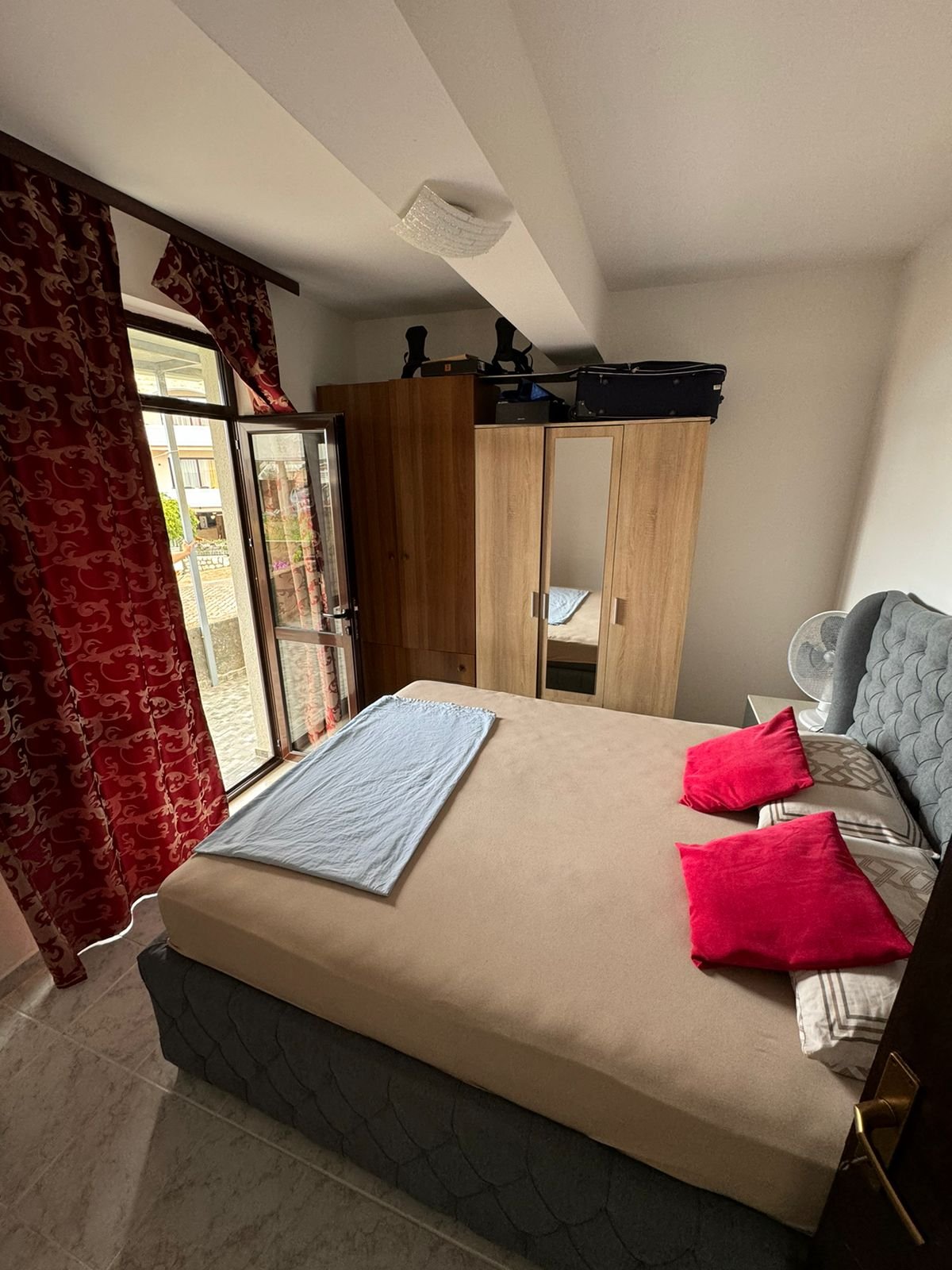 Discover this cozy Ulcinj bedroom with outdoor access, mirrored wardrobe, and stylish finishes&mdash;exclusive at immorenta.me by ekosphere doo.