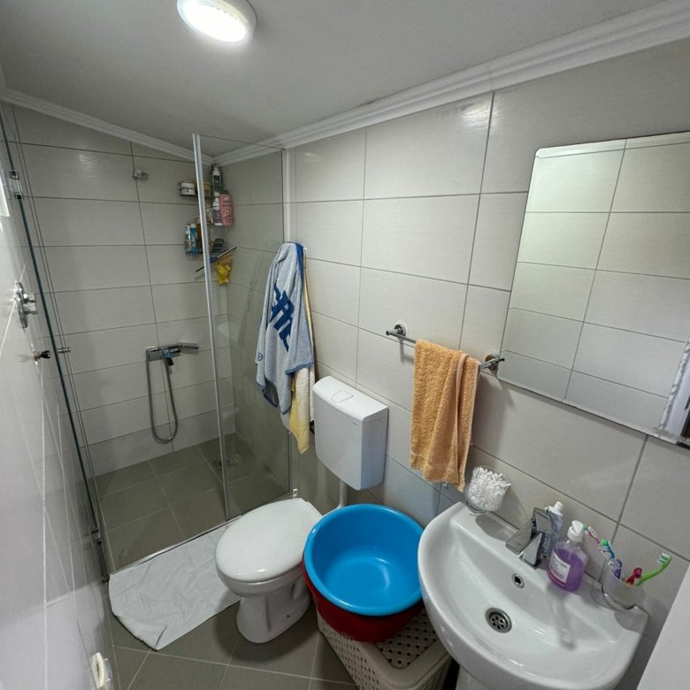 Modern, compact bathroom in Ulcinj features shower, sink, storage&mdash;ideal investment on immorenta.me by Ekosphere doo.