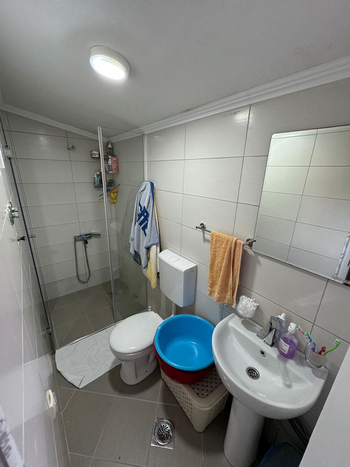 Modern, compact bathroom in Ulcinj features shower, sink, storage&mdash;ideal investment on immorenta.me by Ekosphere doo.