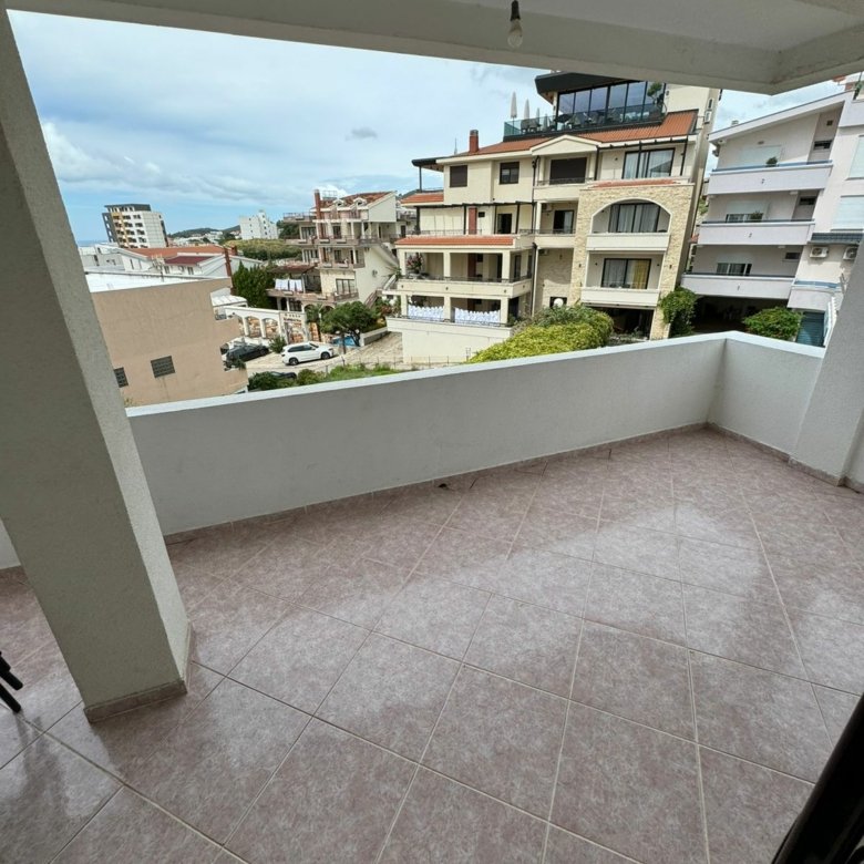 Spacious tiled balcony with sea views over Ulcinjs property market&mdash;exclusive real estate by ekosphere doo at immorenta.me.