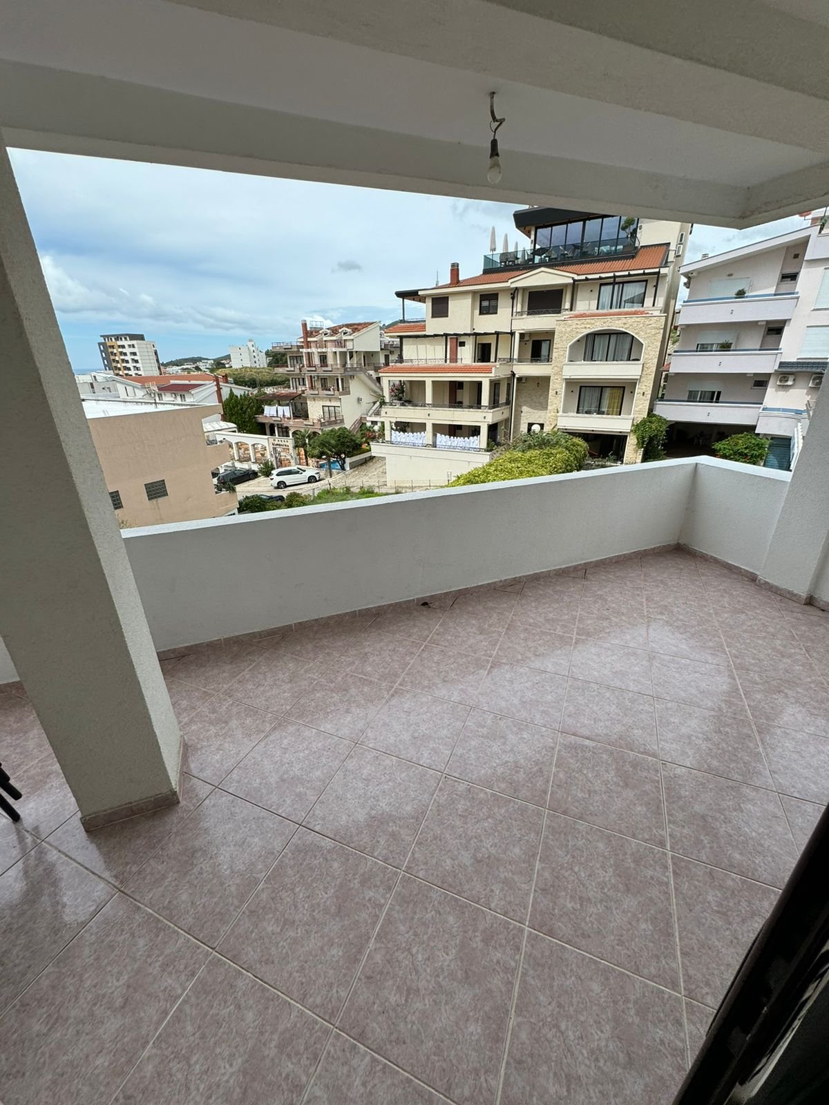 Spacious tiled balcony with sea views over Ulcinjs property market&mdash;exclusive real estate by ekosphere doo at immorenta.me.