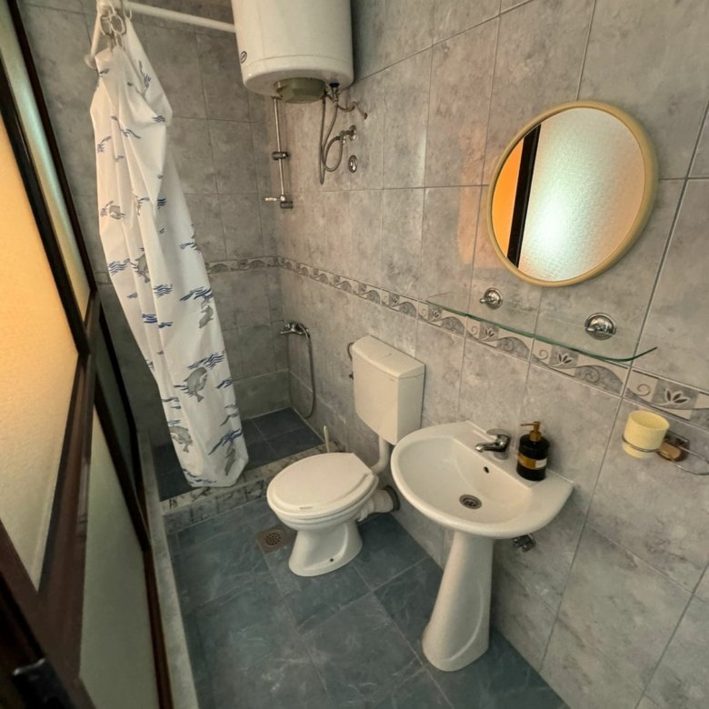 Modern tiled bathroom in Ulcinj property&mdash;shower, toilet, sink, quality fittings. Smart real estate buy via ekosphere doo & immorenta.me.