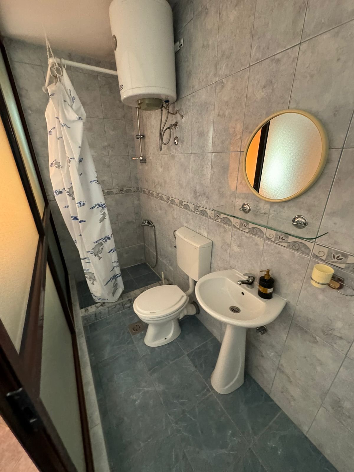 Modern tiled bathroom in Ulcinj property&mdash;shower, toilet, sink, quality fittings. Smart real estate buy via ekosphere doo & immorenta.me.