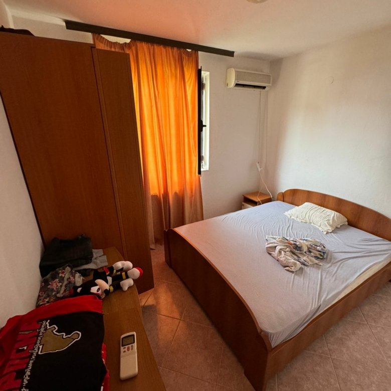 Charming Ulcinj bedroom with wooden double bed, wardrobe, AC&mdash;perfect cozy Montenegro property from ekosphere doo via immorenta.me.