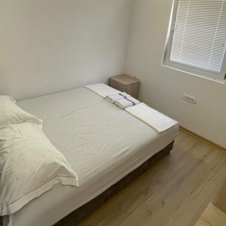 Charming Ulcinj bedroom with double bed, bright floors, and modern touches&mdash;ideal Montenegro real estate by immorenta.me/ekosphere.