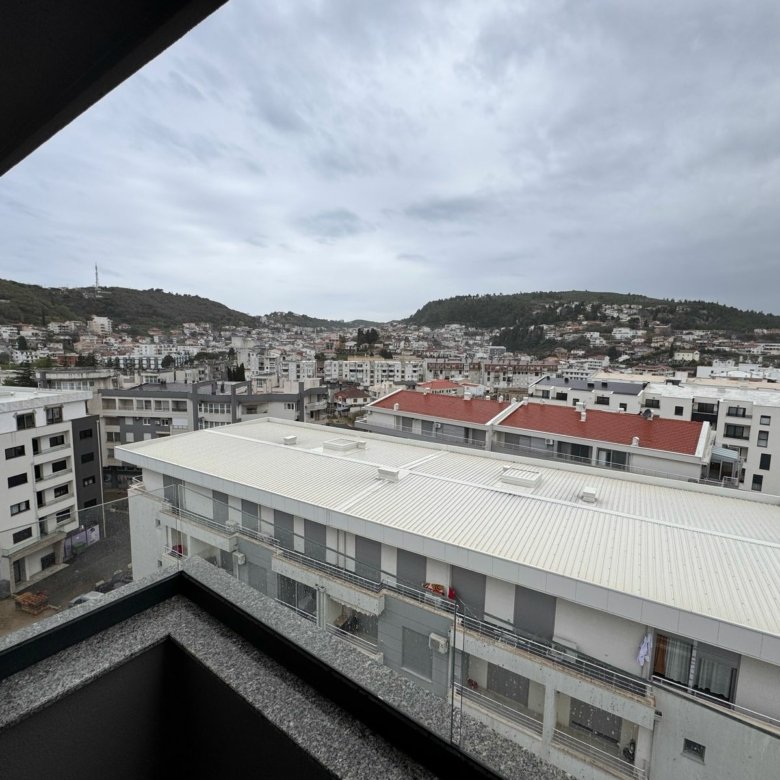 Panoramic balcony view of Ulcinj real estate&mdash;modern homes, investment opportunities, scenic hills. Montenegro-listings.me by ekosphere doo.