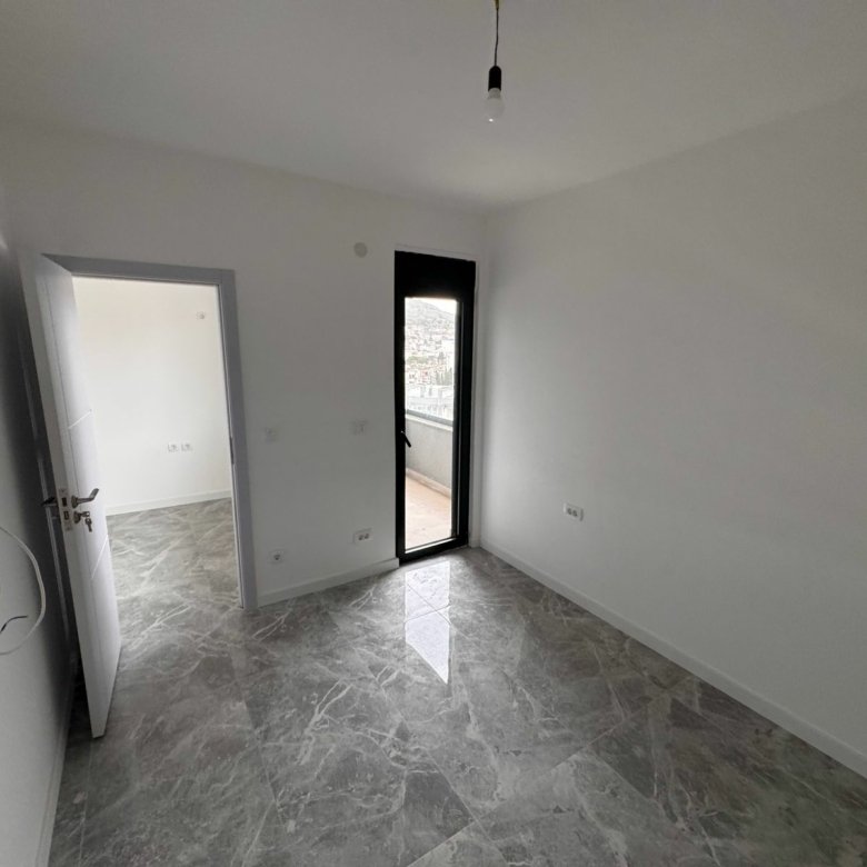 Spacious, modern room with white walls, marble tiles in Ulcinj&mdash;prime real estate by Ekosphere. See more at immorenta.me.