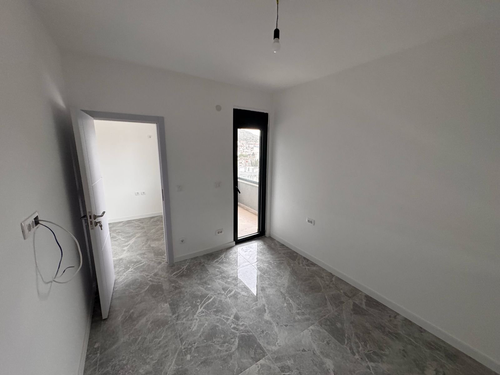 Spacious, modern room with white walls, marble tiles in Ulcinj&mdash;prime real estate by Ekosphere. See more at immorenta.me.