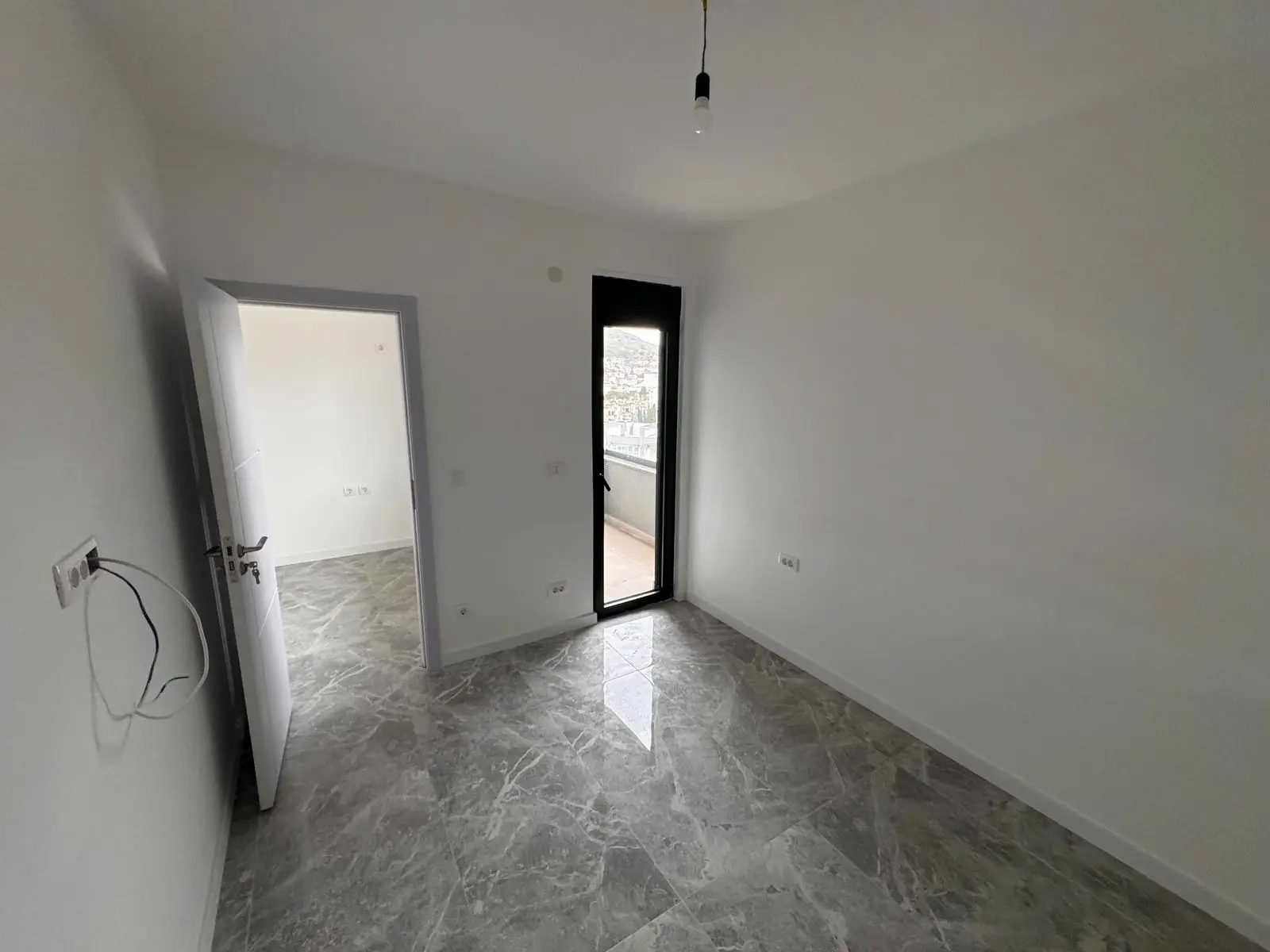 Spacious, modern room with white walls, marble tiles in Ulcinj&mdash;prime real estate by Ekosphere. See more at immorenta.me.