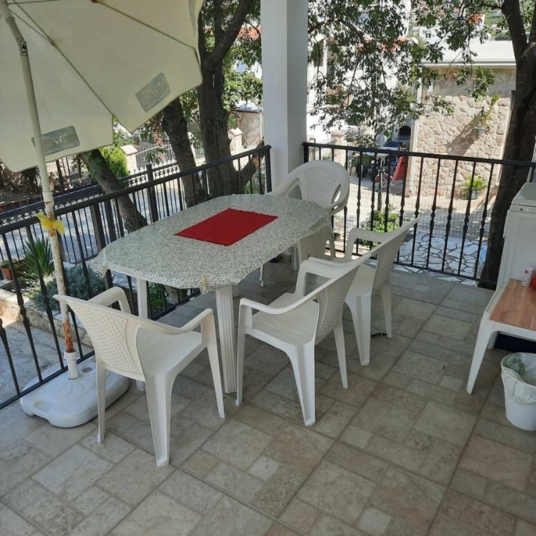 Elegant Ulcinj patio&mdash;table, chairs, umbrella, kitchenette&mdash;ideal outdoor oasis for property buyers via immorenta.me by ekosphere doo.