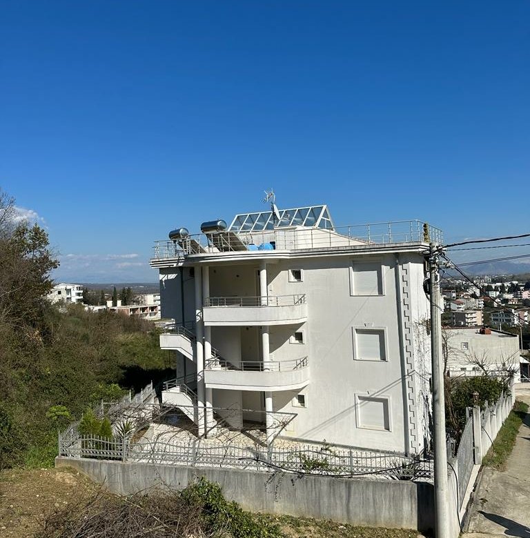 Modern four-story white building with balconies and rooftop, prime Ulcinj property for sale on immorenta.me by Ekosphere.