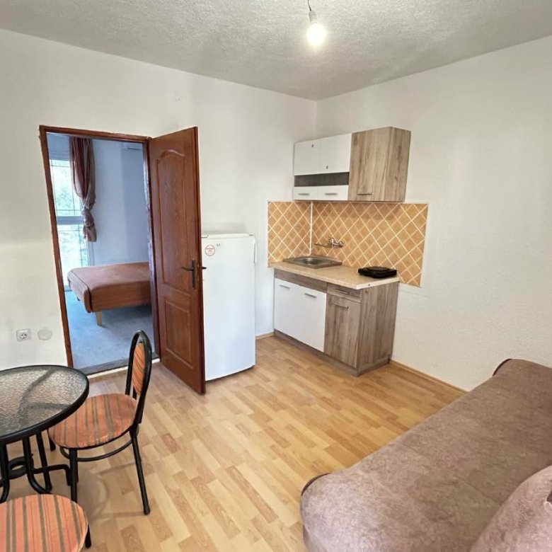 Stylish Ulcinj apartment: kitchenette, dining area, sofa, private bedroom. Top real estate investment via immorenta.me/Ekosphere doo.