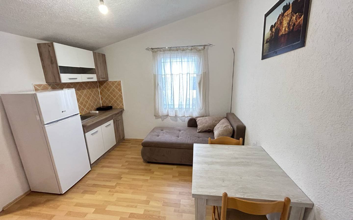 Bright kitchen-living space with wood floors, quality furnishings in Ulcinj&mdash;prime investment from immorenta.me by Ekosphere.