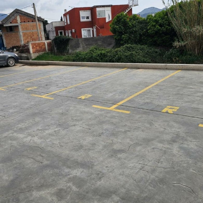 Spacious parking near prime Ulcinj real estate, close to vibrant properties and greenery. Exclusive on immorenta.me by ekosphere doo.