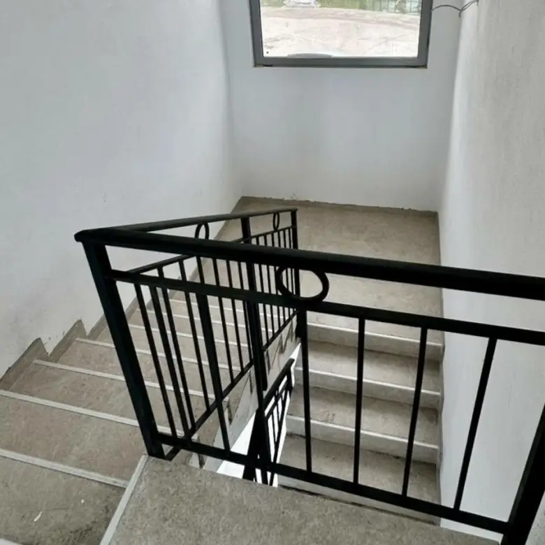 Modern concrete staircase with metal railings in Ulcinj property; investment potential&acirc;exclusive at Montenegro-Listings.me, by Ekosphere DOO.