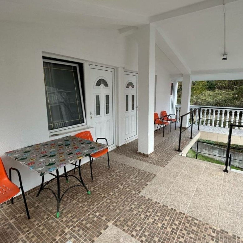 Stylish covered patio in Ulcinj, Montenegro&mdash;tiled floors, modern seating, ideal property investment on immorenta.me by ekosphere doo.