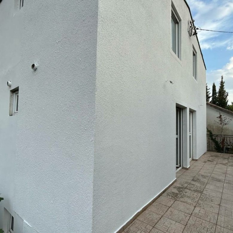 Modern two-story white property with patio in Ulcinj, Montenegro&mdash;ideal investment from immorenta.me by ekosphere doo.